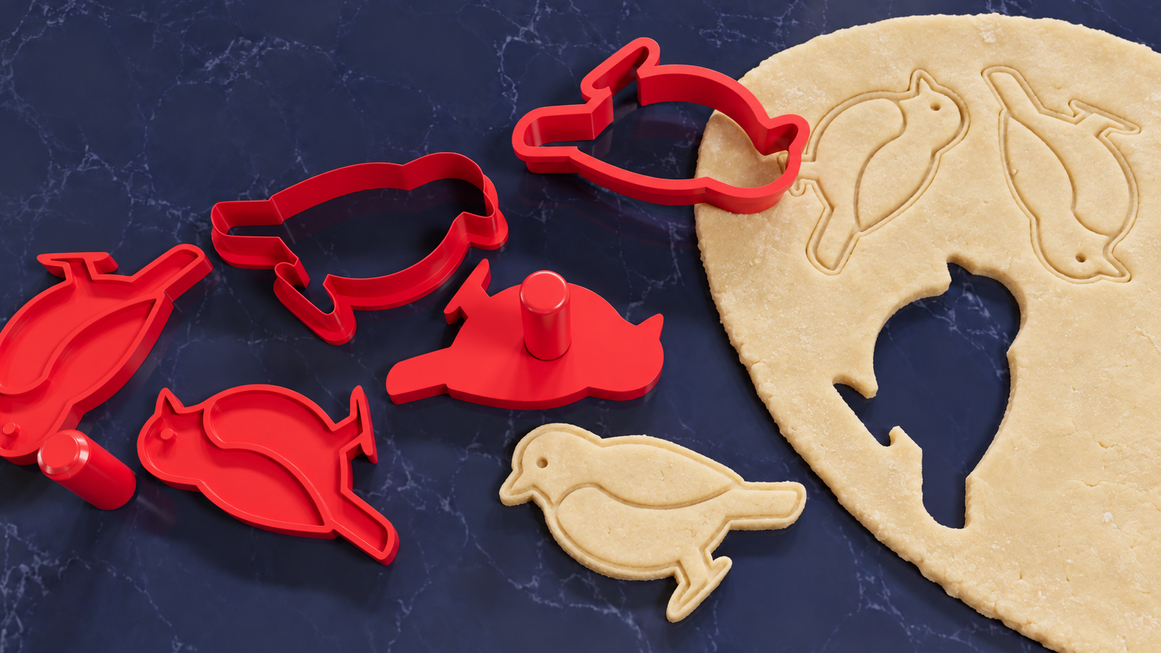 Render de cortadores y sellos rojos con forma de pájaro y mangos separados, impresiones en una lámina de masa y una pieza recortada con forma de pájaro